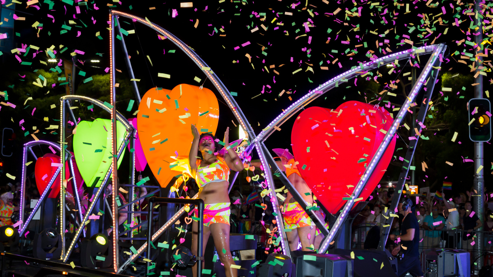 The Sydney Opera house float with heart shaped objects and lit-up strip lights.