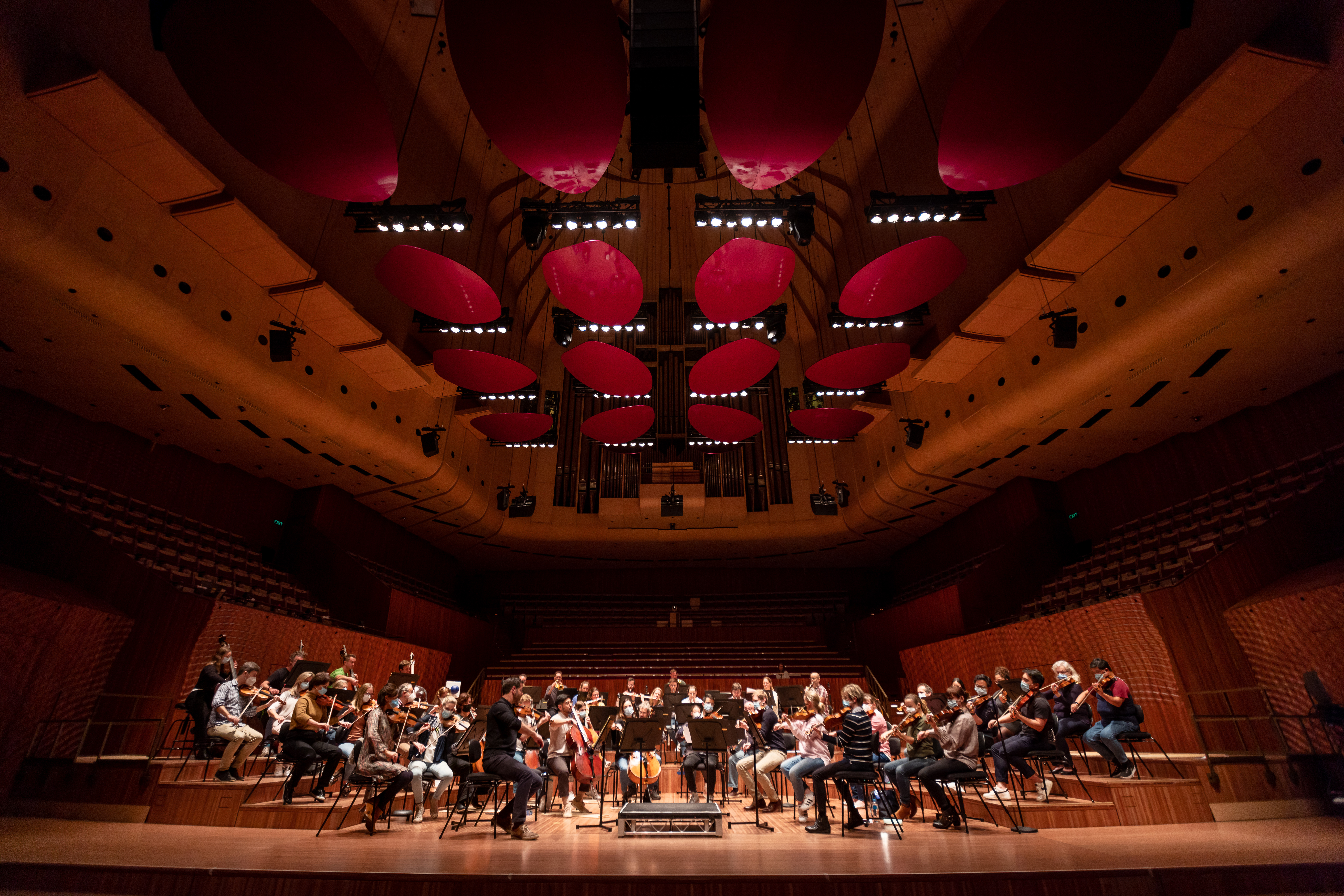 An Orchestra on the Concert Hall stage.