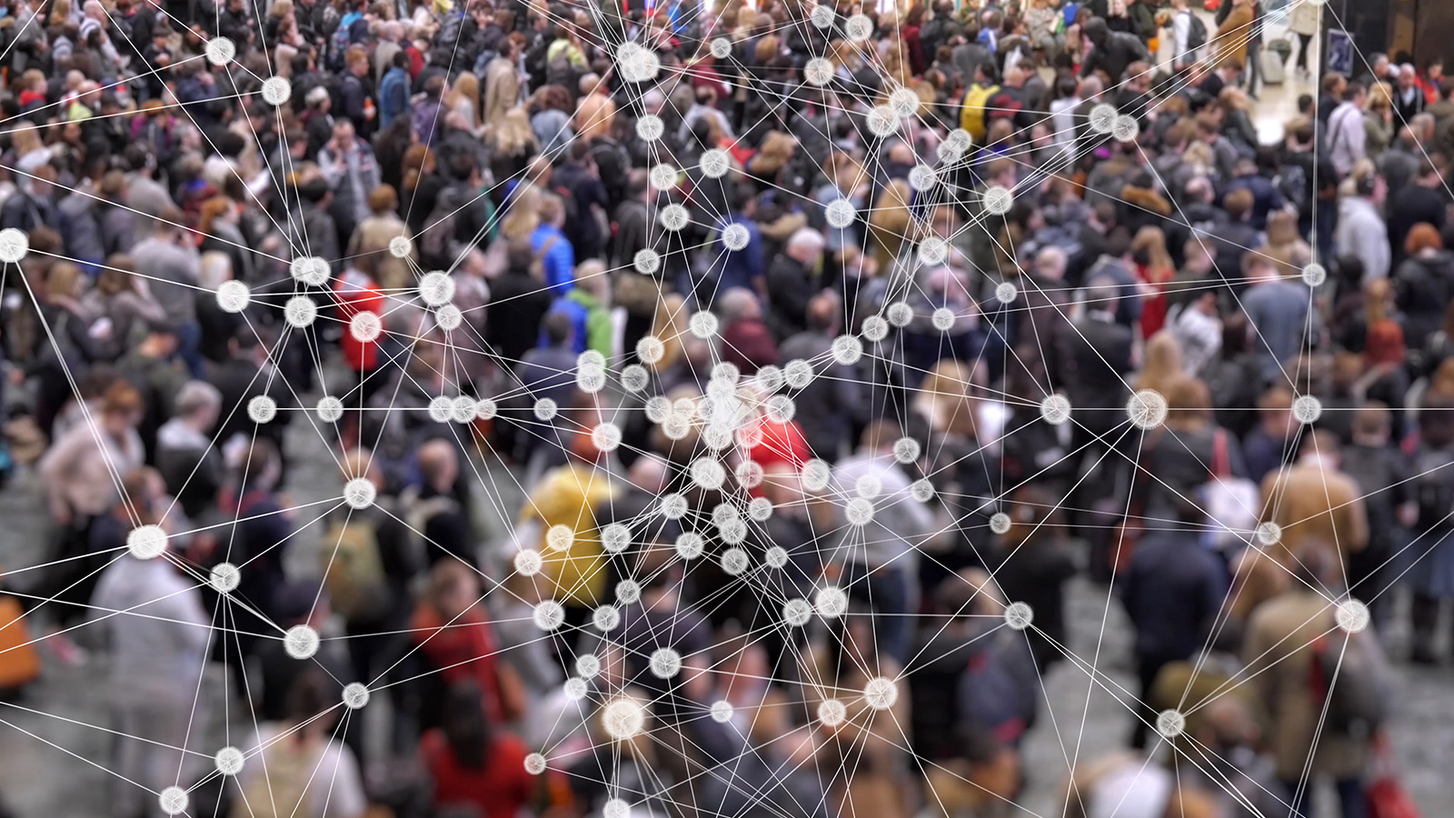 A diagram of multiple covalent bond with crowd of people in the background.