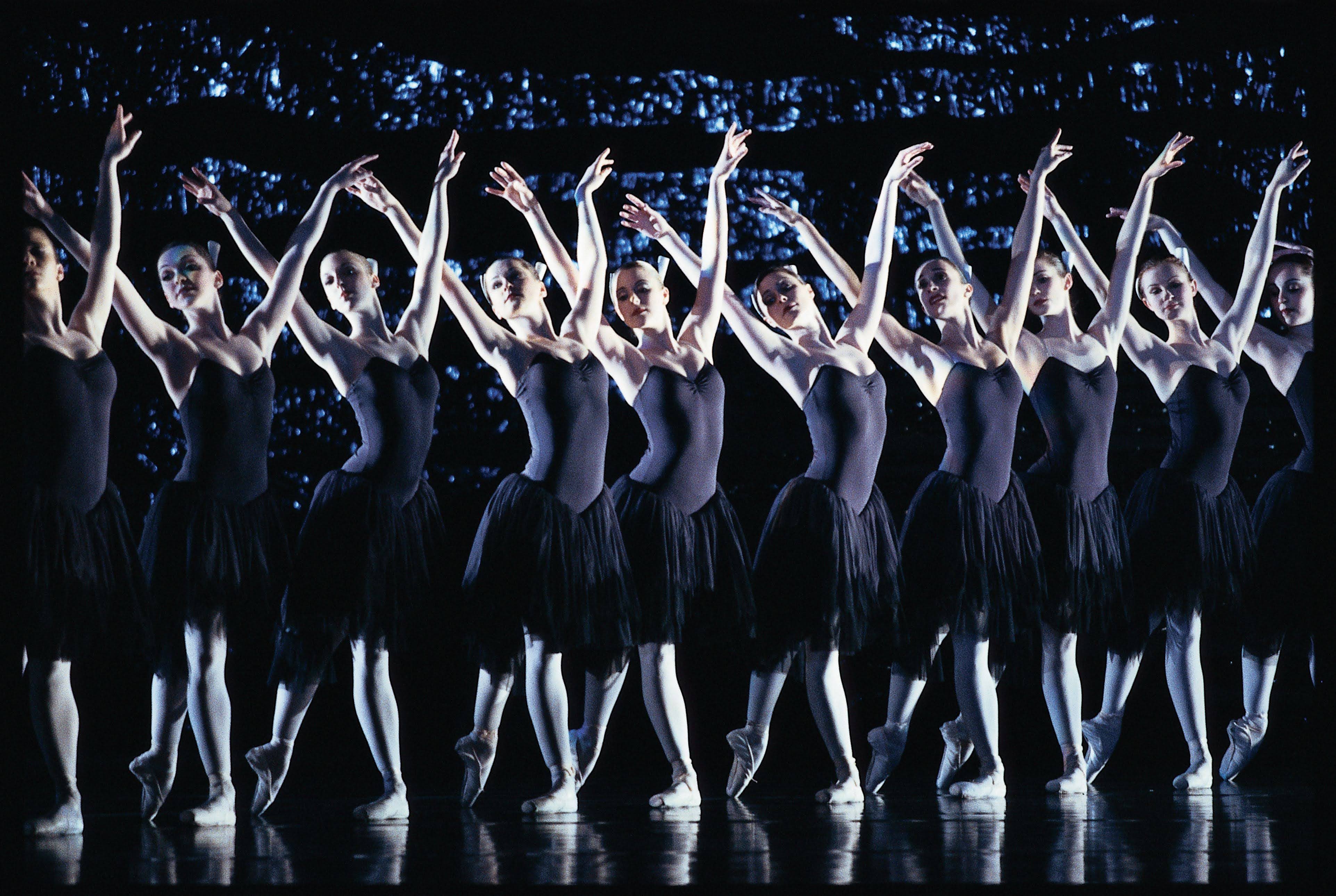 Women performing ballet on the stage.