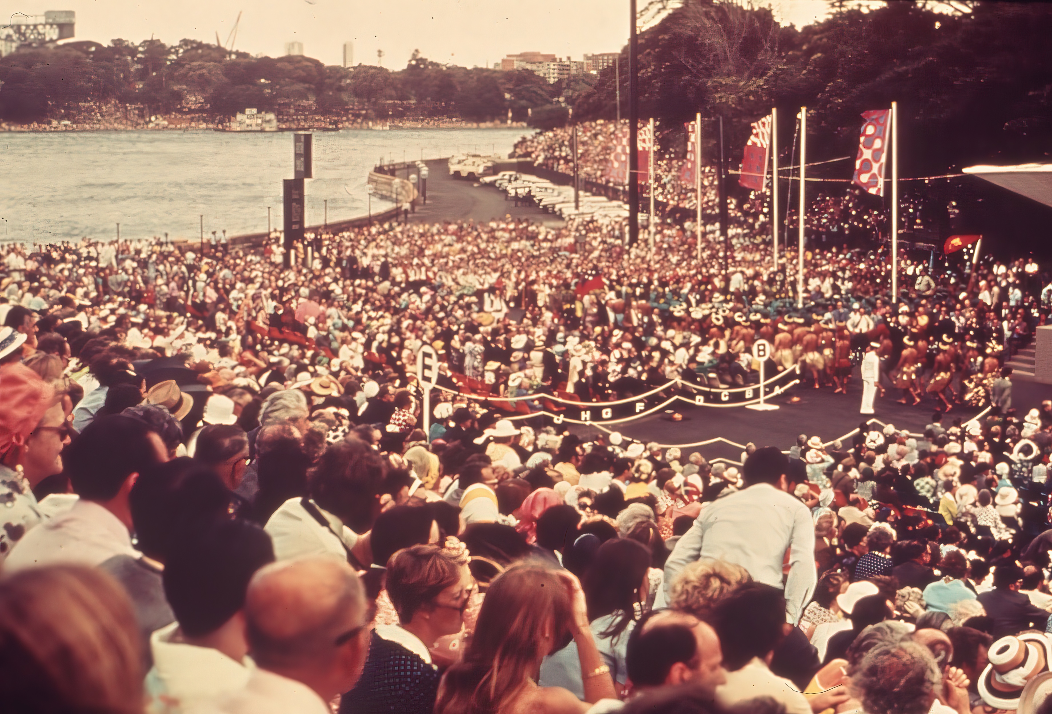 An audience sitting on the monumental steps of Sydney Opera House.