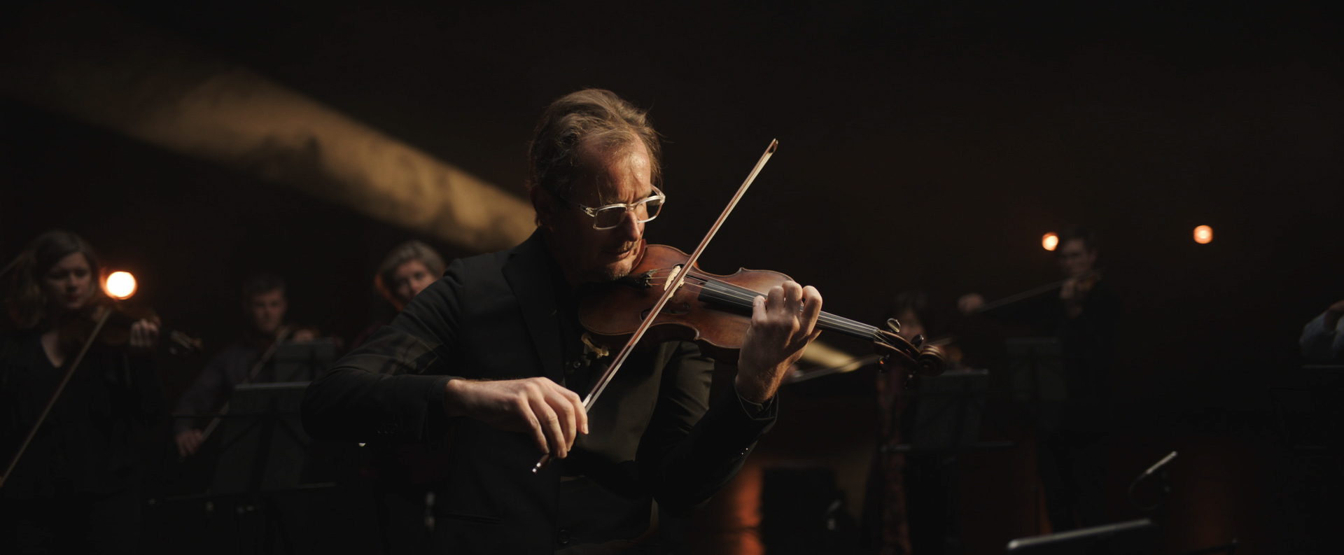 A man playing a violin.
