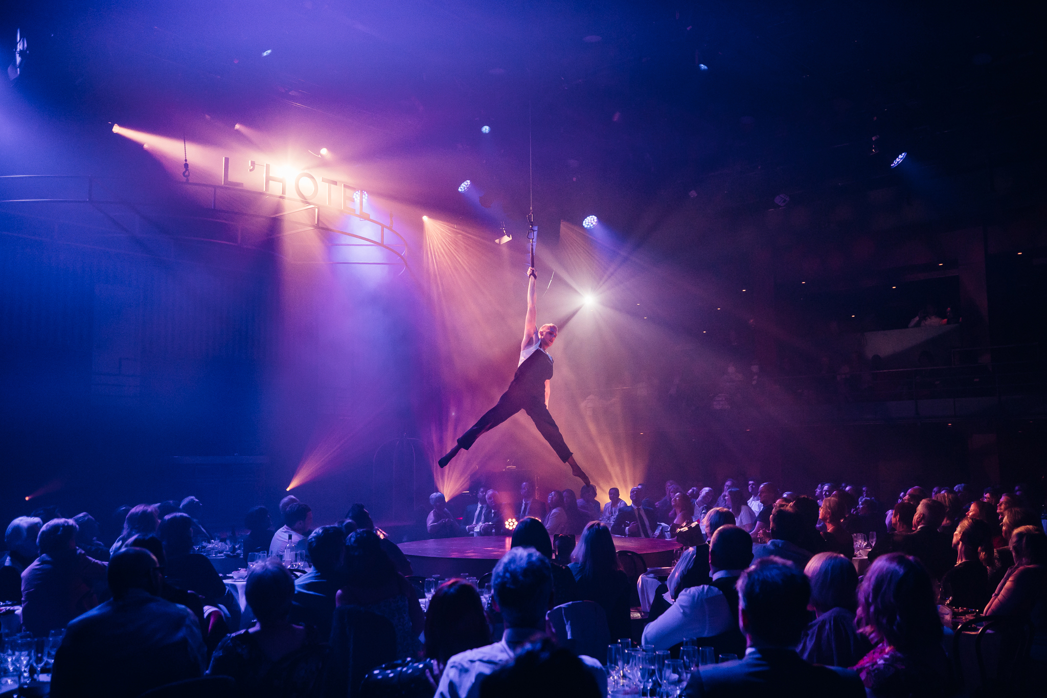 A man doing an aerial performance.