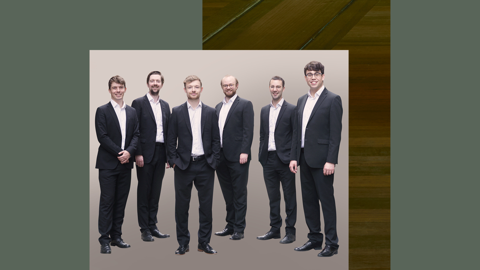 A group of six men in black suit.