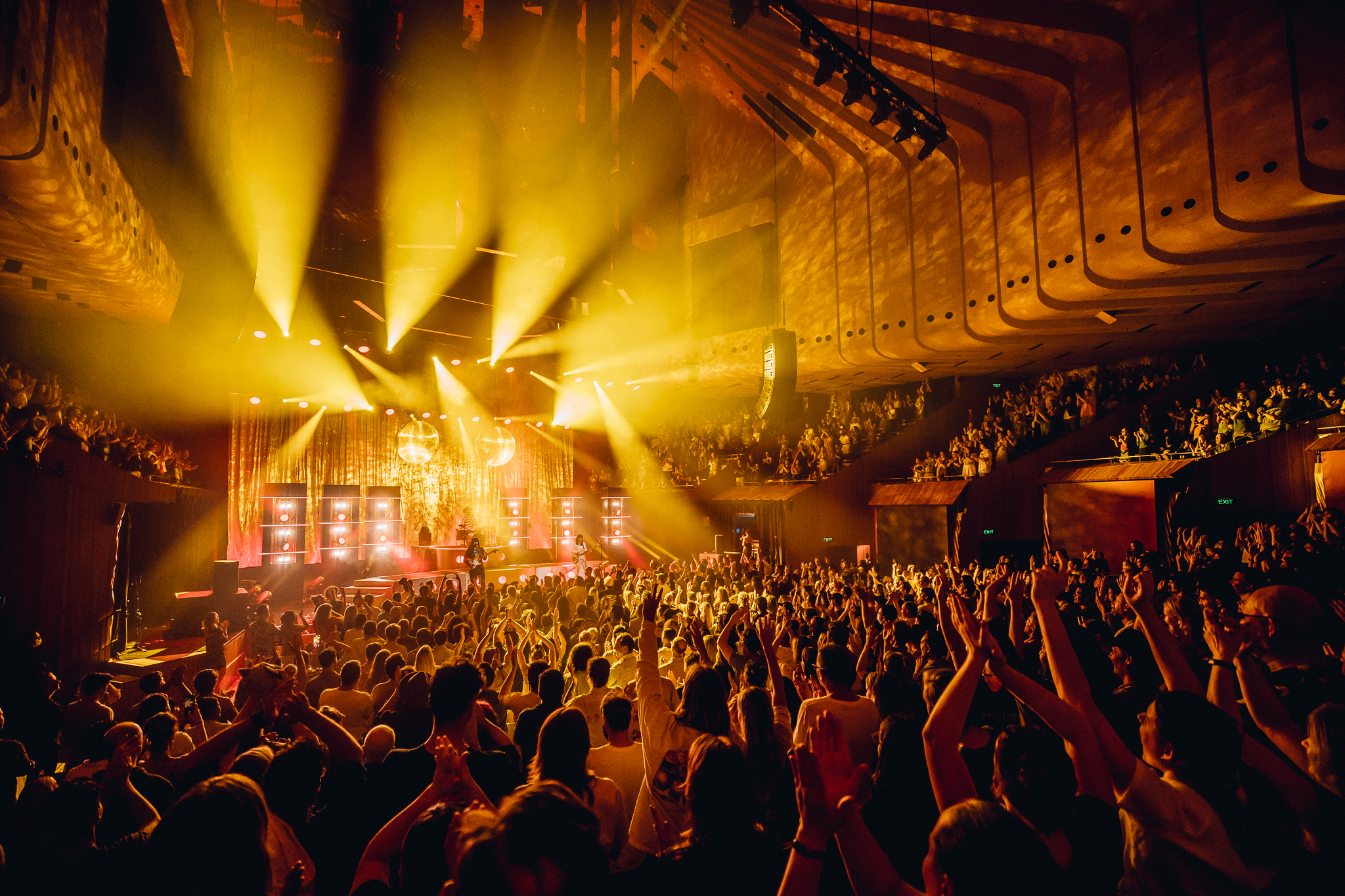 A crowd of people enjoying a musical concert.