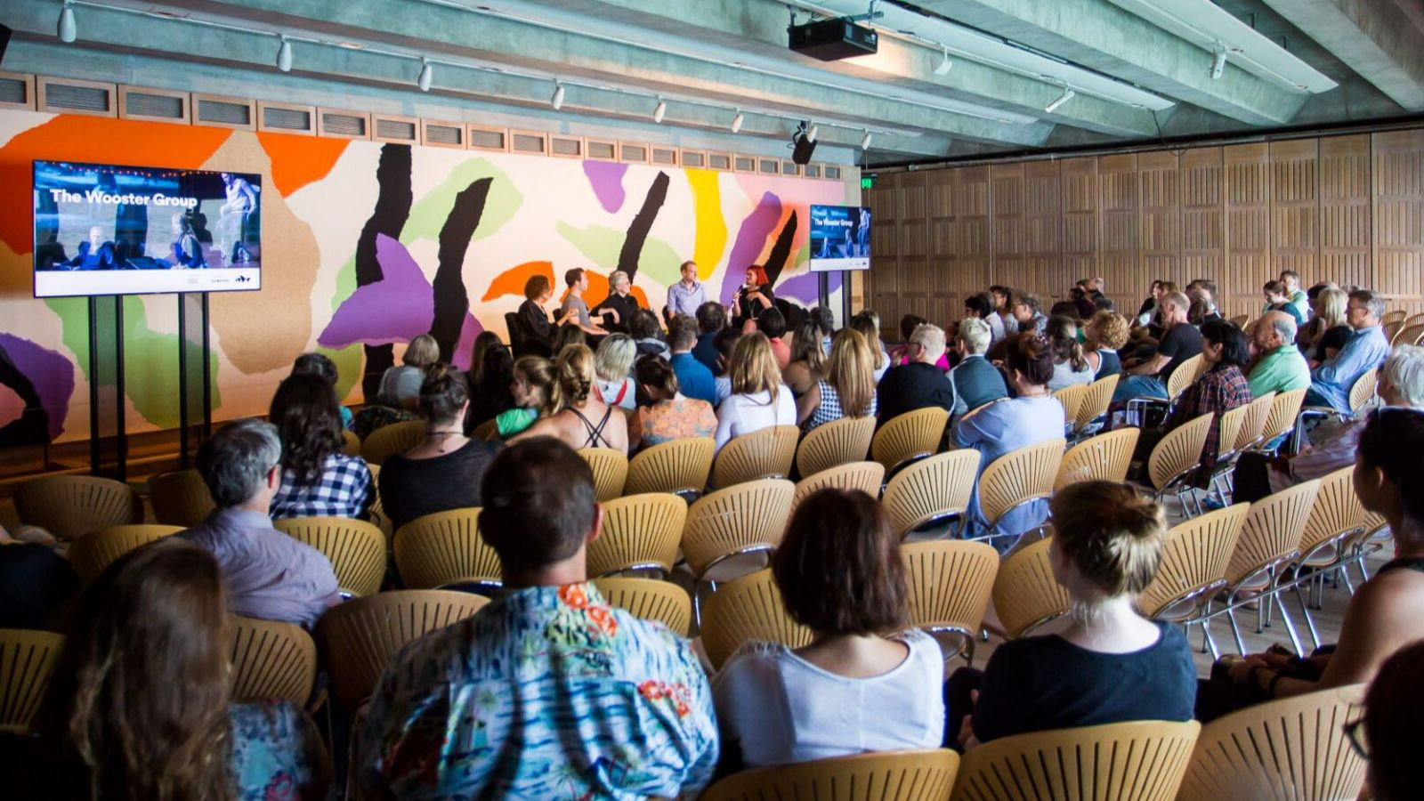 A crowd of people in the Utzon's room attending a workshop.