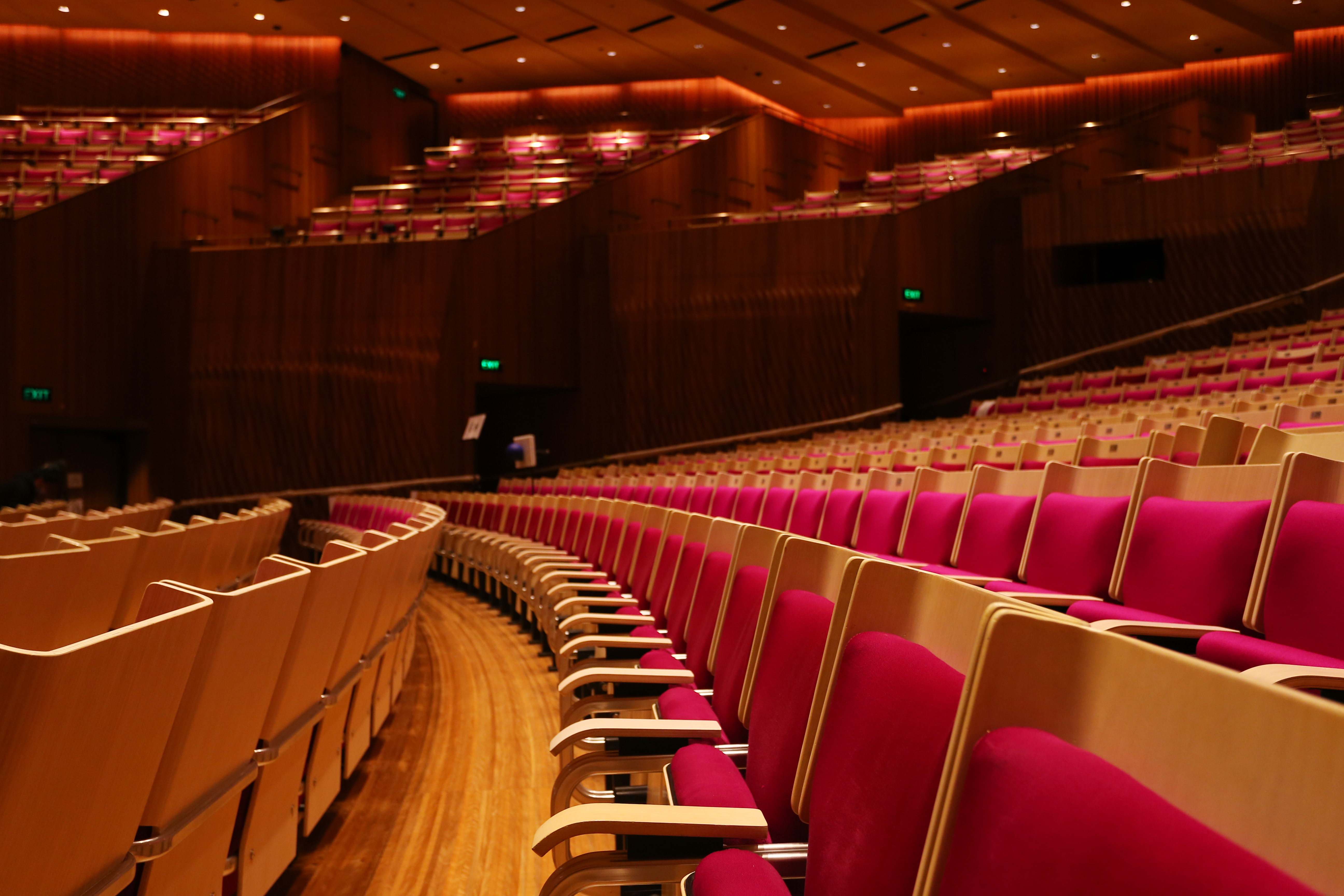 Empty magenta seats in the Concert Hall at Sydney Opera House.