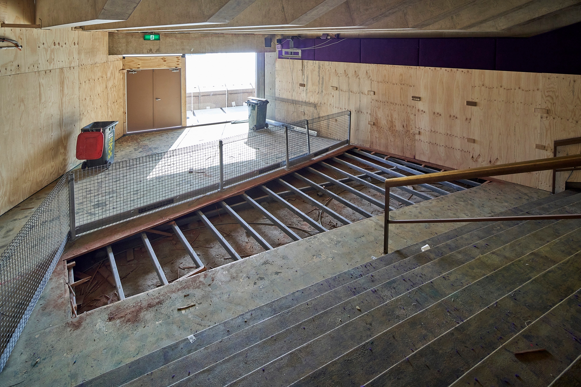 The carpet being stripped from the staircase of the Northern foyer.
