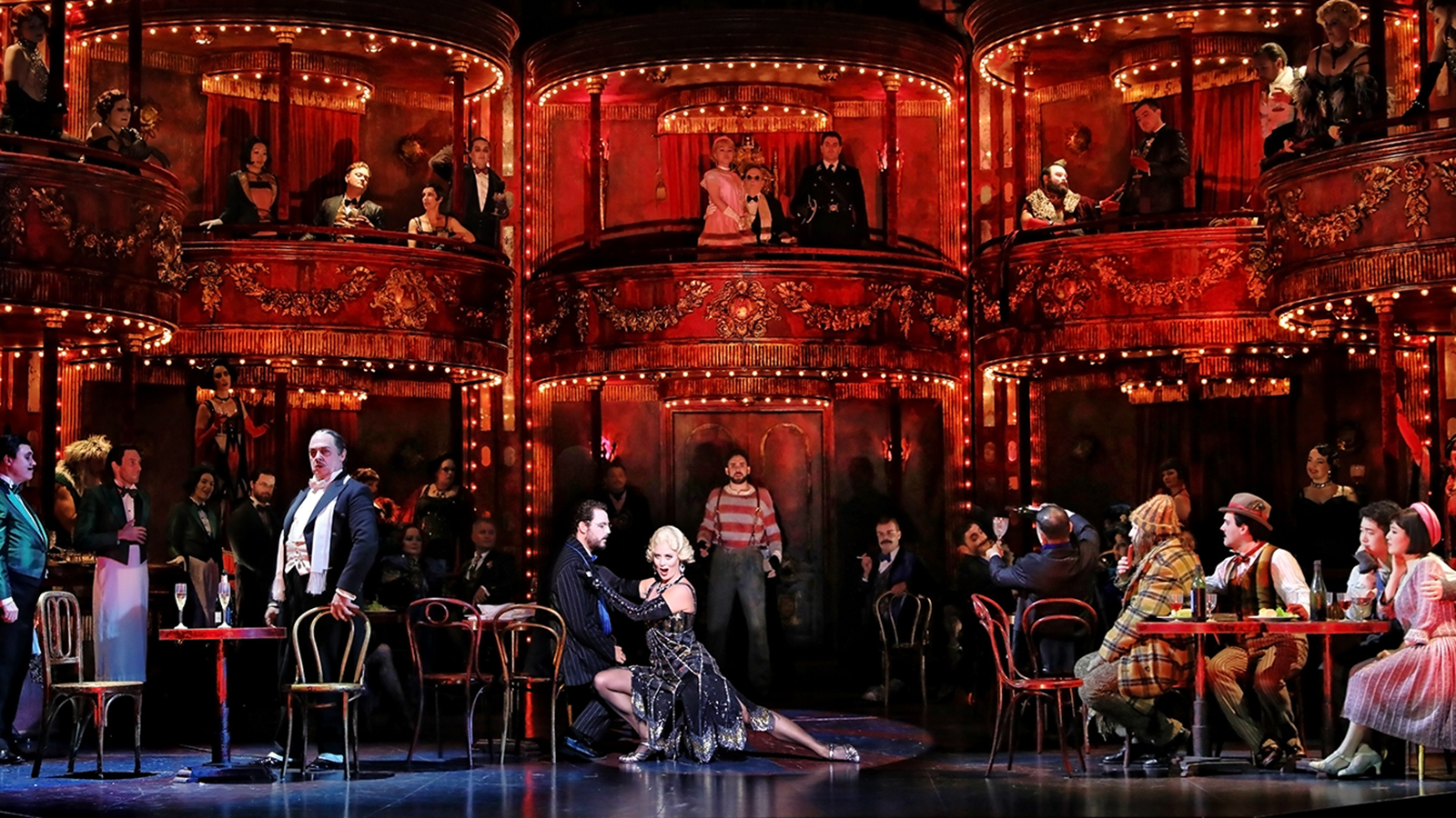 A woman dancing on the stage set up as restaurant.