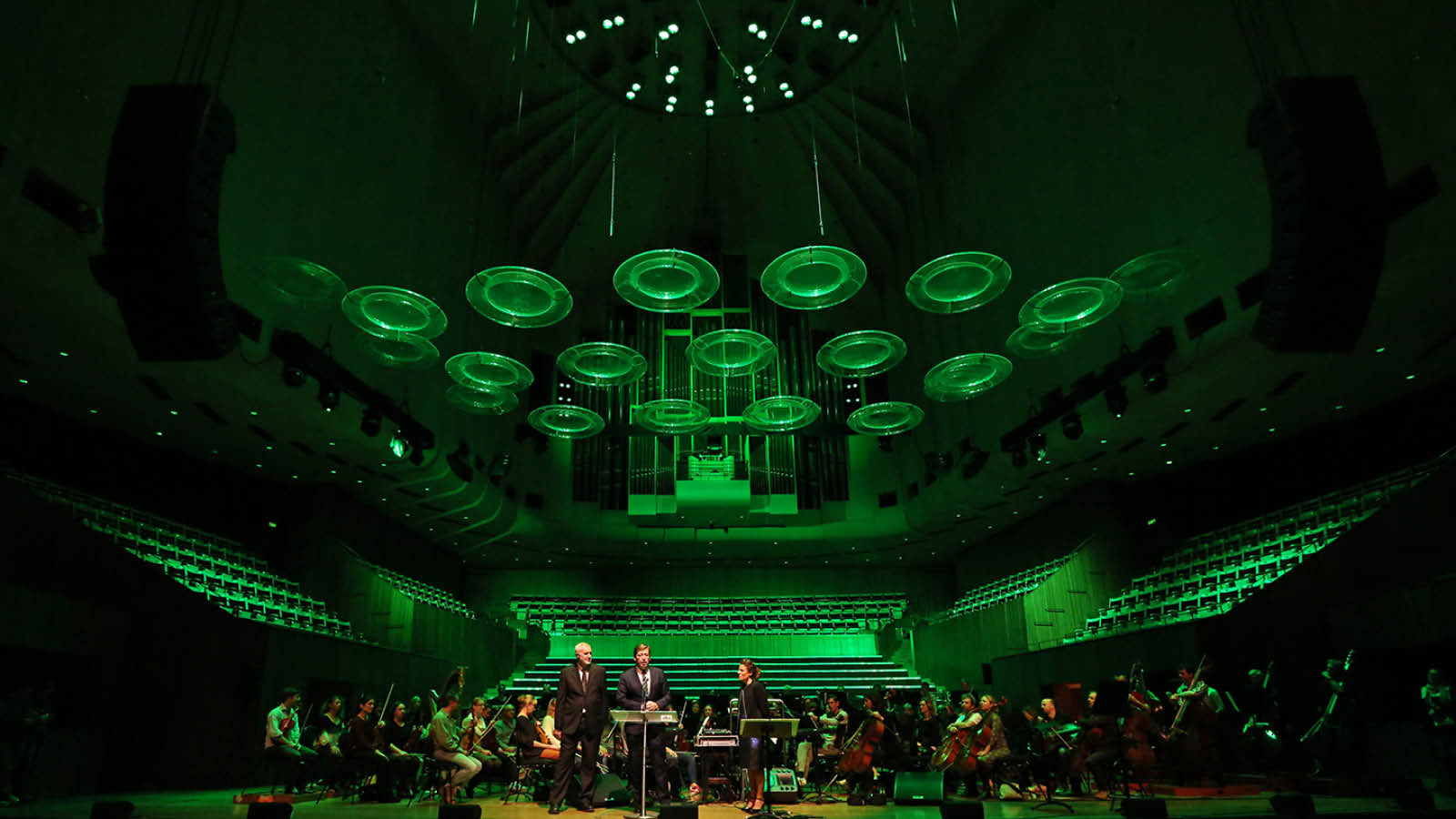 An orchestra performing on the Concert Hall stage.