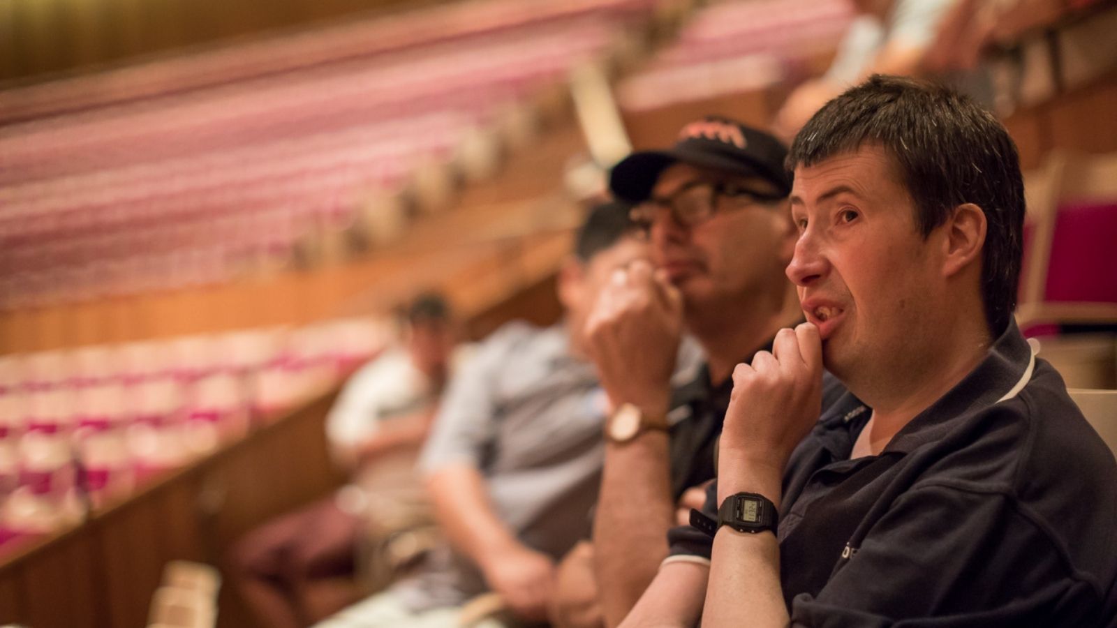 Two men sitting in the Concert Hall.