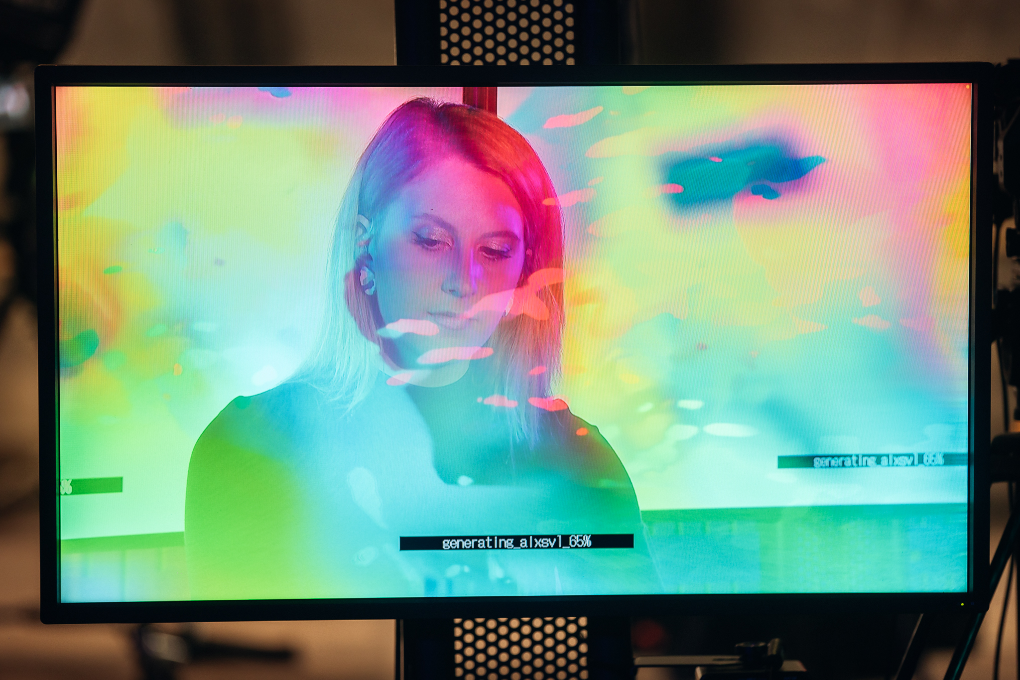 A screen displaying an image of a person with multicoloured areas