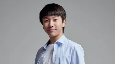 Australian violinist Christian Li in a blue collared shirt