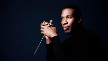 A close up of conductor Roderick Cox