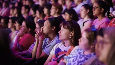 a group of women in a theatre look onto a live talk at all about women 2024