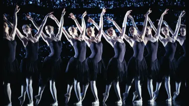 Women performing ballet on the stage.