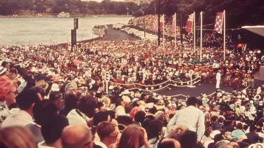 An audience sitting on the monumental steps of Sydney Opera House.