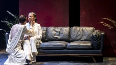 A man caresses a woman's face.