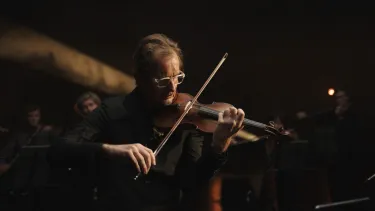 A man playing a violin.