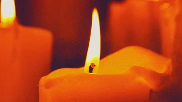 A set of lit red candles.
