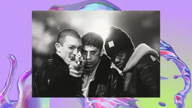 A black and white image of three men looking into the camera. One is pointing a gun.
