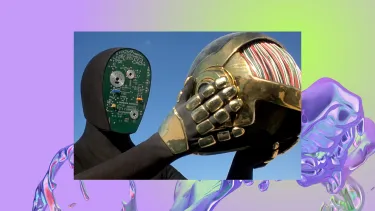 A robot stands holding a helmet in it's hands. It's face is a computer chip.