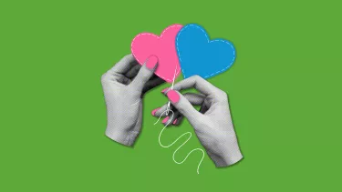 Two hands sewing together hearts.