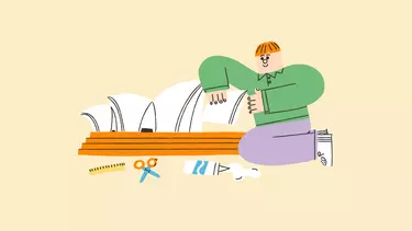 An illustration of a boy in a green shirt and purple pants kneeling, constructing a model of the Sydney Opera House with scissors, glue and ruler around.