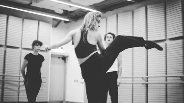 A woman dancing in a studio.