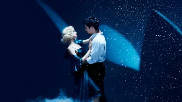 A couple is dancing on the stage.