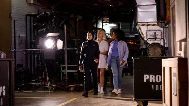 A tour guide showing the backstage of the Sydney Opera House.