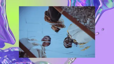 The reflection of three men seen in a mirror. The background is an iridescent purple swirl, looking like water.