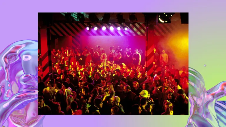 A crowd is gathered in a busy club.