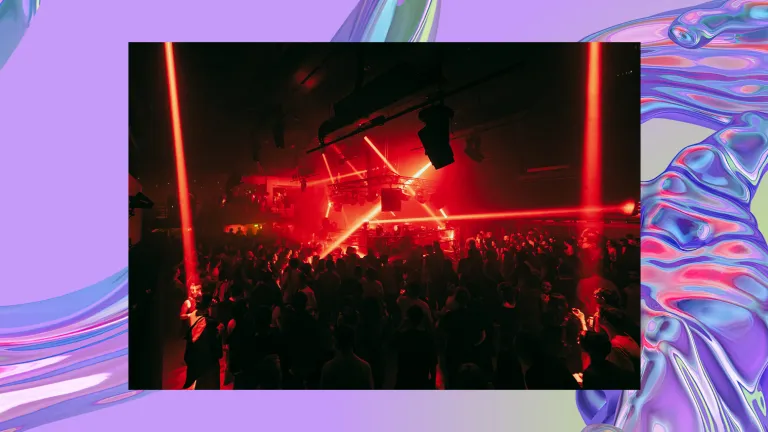 A lively nightclub scene with red lasers illuminating a crowded audience. The image overlays a background of a purple iridescent swirl, looking like water.