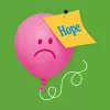 A pink balloon with a sad face on it has a post it note saying 'hope' pinned into it.
