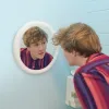 Josh Thomas staring into a mirror