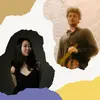 A man holding a violin and a woman standing next to him