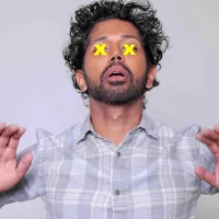 A man in a shirt with X X on his eyes.