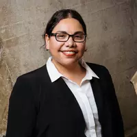 Deborah Mailman a member of the trust at Sydney opera house in a suit.