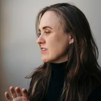 Frances Barrett, a woman with pale skin and brown hair.