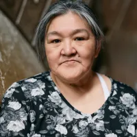 A portrait of Ningiukulu Teevee inside the Opera House.