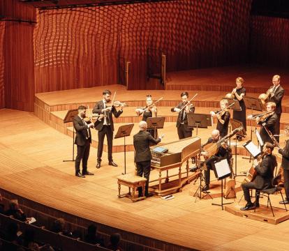 A small chamber orchestra with Harpsichord stand at the Sydney Opera House concert hall