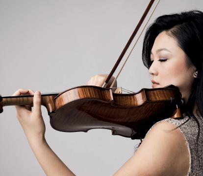 A woman playing a violin.