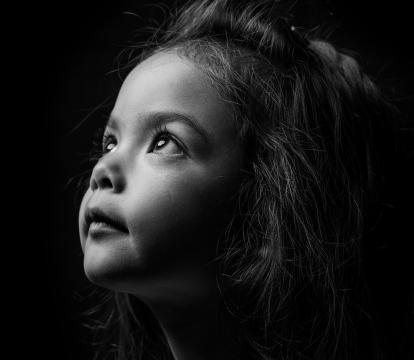 A girl looking at the sky.