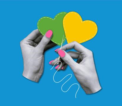 Two hands sewing together hearts.