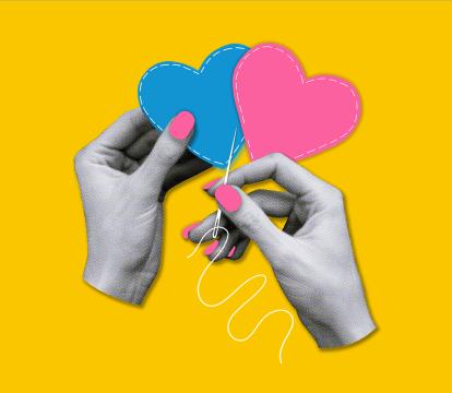 Two hands sewing together hearts.