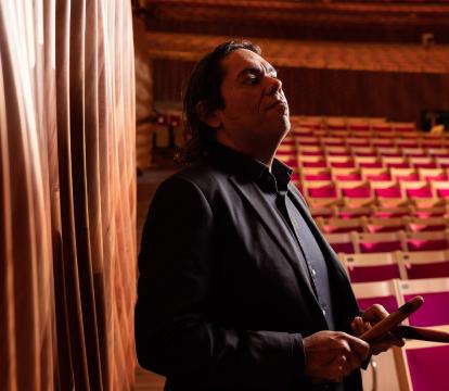 Australian multi-instrumentalist William Barton stands in the Opera House Concert Hall.