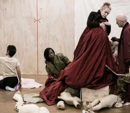 A group of artists doing a theatre rehearsal.