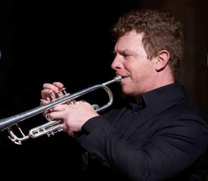 Brent Grapes plays the trumpet.