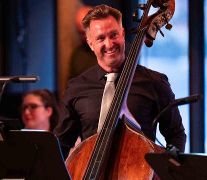 David Campbell stands with a double bass.